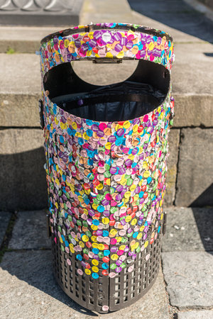 Gothenburg , Sweden - April  2017: Trash can outside Gothenburg Art Museum almost completely covered...
