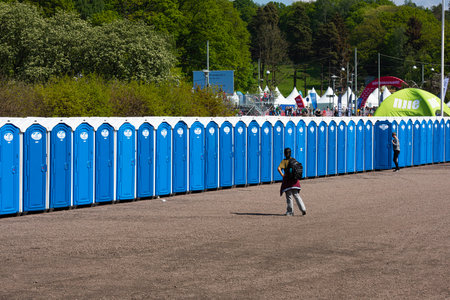 Gothenburg , Sweden - May 19 2019: Long row of portable toilets at the starting area of Göteborgsvarvet.のeditorial素材