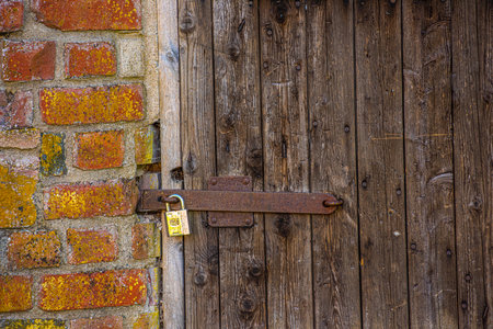 Alingsås, Sweden - June 29 2019:Modern padlock on a door at Gräfsnäs slott.のeditorial素材