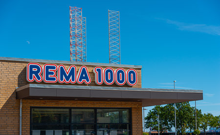 Frederikshavn, Denmark - July 9 2019: Logo of REMA 1000 on one of their stores.のeditorial素材