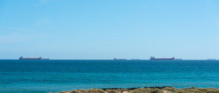 Skagen, Denmark - July 10 2019: Tank ships in the horizon waiting for cargo.のeditorial素材