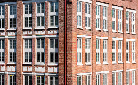 Large office building in brick with huge white windows.の写真素材