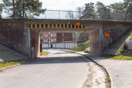 Low tram bridge over a snall road in the suburbs.の写真素材