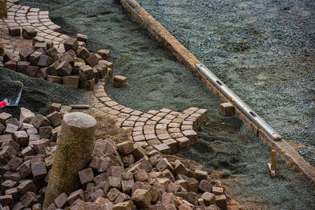 Cobblestone being removed to make a new section of pavement.の写真素材