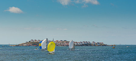 TjÃ¶rn, Sweden - August 17 2013: TjÃ¶rn Runt is an annual long distance sailing competition that takes place around the island of TjÃ¶rn. View from RÃ¶nnÃ¤ng with Ãstol island in the background.のeditorial素材