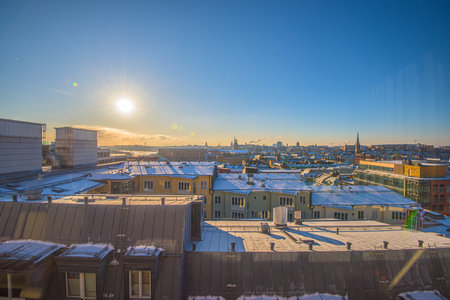 Stockholm, Sweden - February 25 2018: Rooftop view over Stockholm. The royal palace in the center left.  Towers of Saint Gertrud church, Katarina church, and Stockholm Cathedral. Globen in the horizon.のeditorial素材
