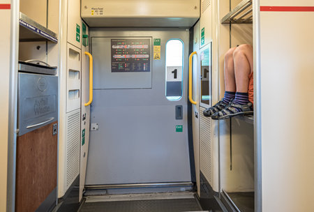Oslo, Norway â june 19 2017: A kid sitting in the luggage compartment on a train.のeditorial素材