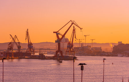 Gothenburg, Sweden - april 12 2019: The old cranes in beautiful sunrise light.のeditorial素材