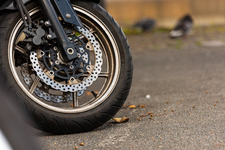 Gothenburg, Sweden â September 20 2019: Front wheel and brakes of a motorcycle.のeditorial素材