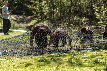 Gothenburg, Sweden - April 26 2014: Participants of the Tough Viking obstacle race in Slottsskogen.のeditorial素材