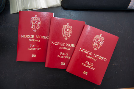 Oslo, Norway - july 18 2016: Tree norwegian passports on a black table.のeditorial素材