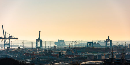 Gothenburg, Sweden â March 26 2020: Skandiahamnen at sunset. ships, containers and ship to shore cranes at work.のeditorial素材