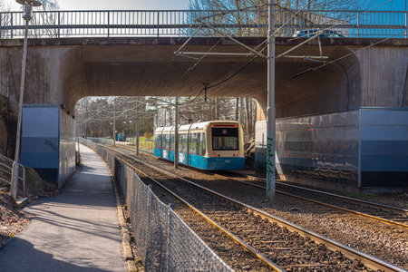 Gothenburg, Sweden - march 31 2020: Tram on line 8 to FrÃ¶lunda arriving at Lantmilsgatan.のeditorial素材
