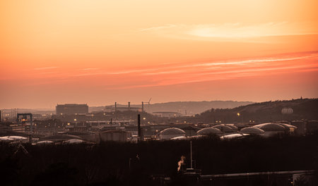 Gothenburg, Sweden - March 26 2020: Evening view of oil tanks at Skarvikshamnen and Volvo Arendal.のeditorial素材