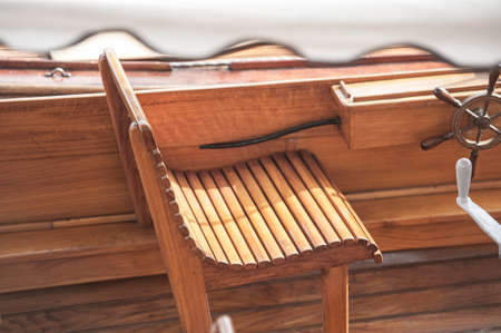 Wooden seat in a vintage, open wooden boat..