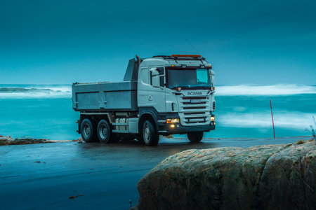 Lindesnes, Norway - december 24 2013: Scania R480 parked by the sea in the eveningのeditorial素材