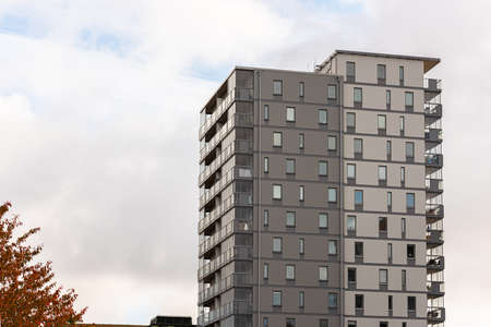 Eleven storey high grey apartment building