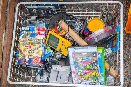 Gothenburg , Sweden - September 4 2010: Box of vintage toys and electronic games at a flee marketのeditorial素材