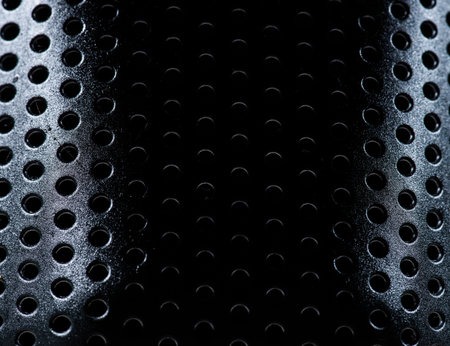 Closeup of a kitchen utensil with small holes