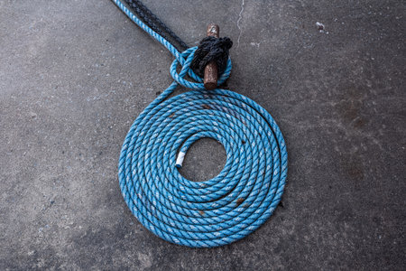 Blue mooring rope laid down in a spiral