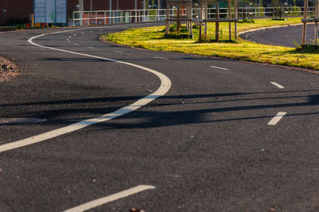 Curvy bike and walking path aling a roadの写真素材