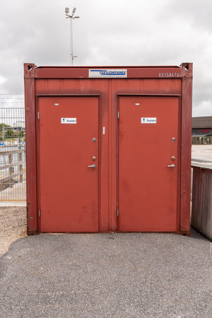 StrÃ¶mstad, Sweden - July 31 2021: Red container containing two portable toilets