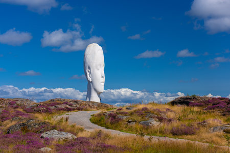 TjÃ¶rn, Sweden - August 19 2021: Sculpture Anna by Jaume Plensa at Pilande sculpture parkのeditorial素材