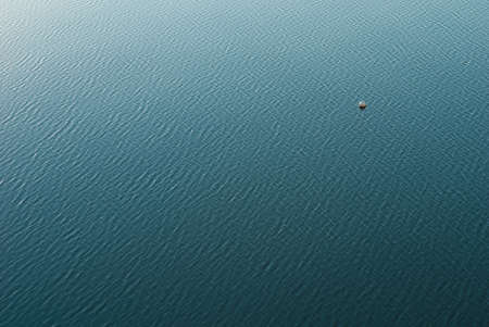 Cyan water with small ripples
