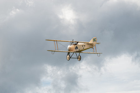 Gothenburg, Sweden - August 29 2010: FVM Tummelisa Ã 1 (replica) flying across the skyのeditorial素材