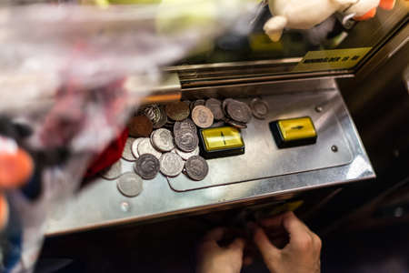 Coins and buttons on a coin machine.