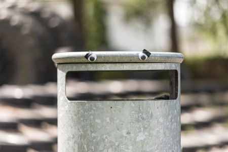 Googly eyes on a nervous trash can..の写真素材