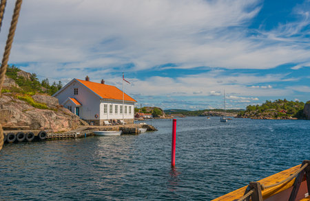 Kristiansand, Norway - July 15 2015: Old, white houses by the sea at Ny-Hellesund.のeditorial素材