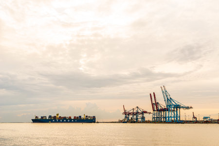 Gothenburg, Sweden - August 27 2015: Huge container ship leaving the harbor.のeditorial素材