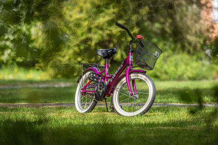 Gothenburg, Sweden - May 05 2019: Purple childrens bike Sierra Belle standing in the grass..のeditorial素材
