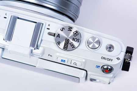 Gothenburg, Sweden - June 18 2019: Top of a white Olympus E-PL6 with 40-150mm lens on white background.のeditorial素材