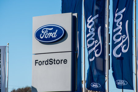 Gothenburg, Sweden - April 25 2020: Ford and FordStore logos on a pylon and flags by a dealership.のeditorial素材