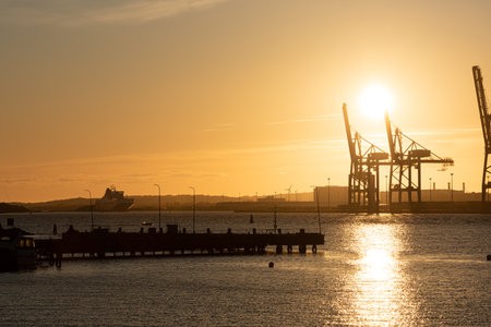 Gothenburg, Sweden - May 03 2020: Large ship to shore container cranes at sunsetのeditorial素材