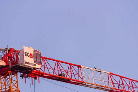 Gothenburg, Sweden - May 30 2020: Red Liebherr EC-B tower crane at sunsetのeditorial素材