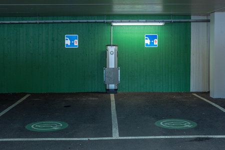 Gothenburg, Sweden - May 22 2021: Electric car charger in a parking garageのeditorial素材