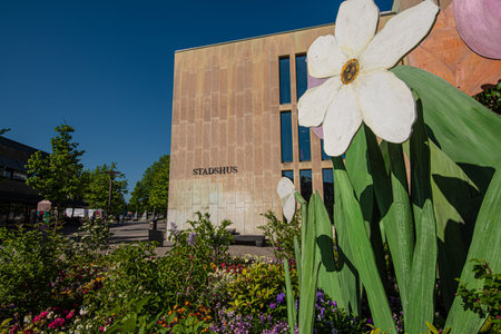 Falkenberg, Sweden - May 29 2021: Decorative fake and real flowers by the city hallのeditorial素材
