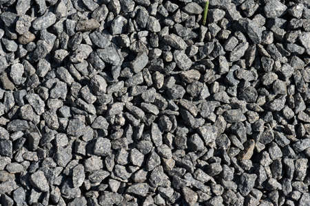 Closeup of grey gravel in the sun