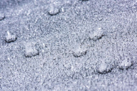 Ice crystals forming on sand grain.