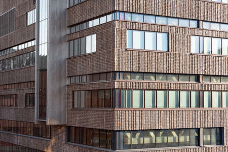 Glass and concrete facade of a high rise office building.の写真素材