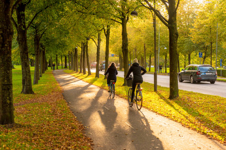 Gothenburg, Sweden - October 10 2019: Low autumn sun over a bicycle road.のeditorial素材