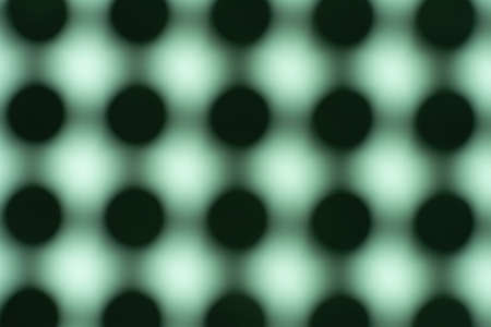 Pattern of black circles on green paper,.の写真素材