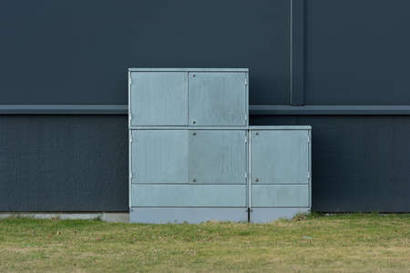 Electrical junction box by the wall of a buildingの写真素材