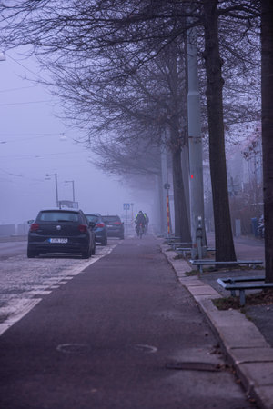 Gothenburg, Sweden - March 23 2022: Bicyclists commuting to work in dense fogのeditorial素材