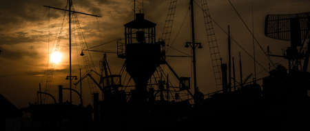 Silhouette of a lighthouse shipand other vintage ships