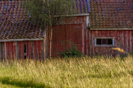 Old abandoned red wooden barn