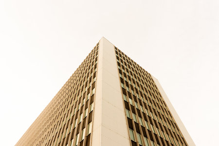 Gothenburg, Sweden - January 10 2021: Looking up tall glass and concrete office high-rise building
